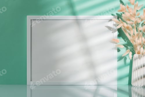 Preview: Blank picture frame and dried flower in a vase on mint background