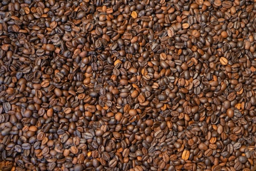 Preview: Roasted coffee bean pattern texture background. Raw food material.