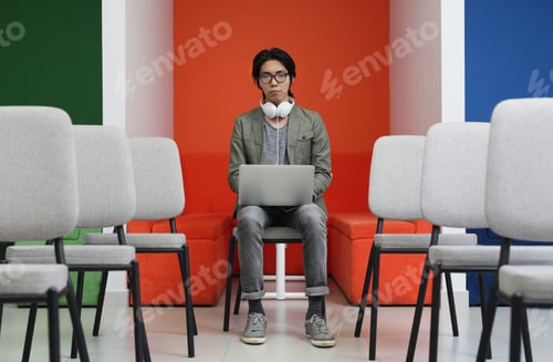 Preview: Asian student using laptop