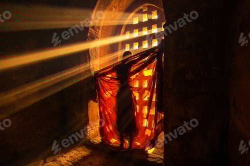 Preview: Back side of monk change the robe with sun ray in pagoda at bagan, mandalay, myanmar