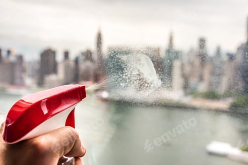 Preview: Cleaning the window with Manhattan skyline on the background
