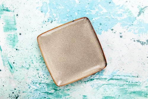 Preview: top view empty brown plate square formed on blue background kitchen food plate cutlery