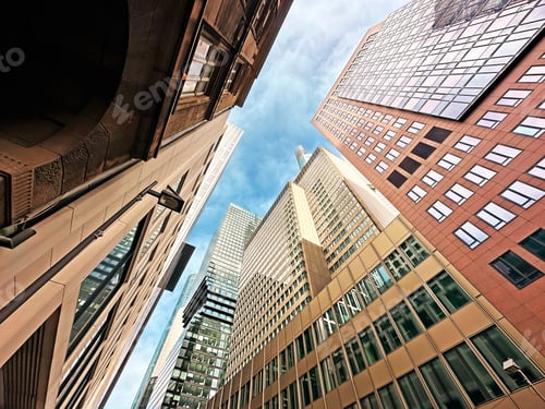 Preview: View To Tops From Below Of Glass Modern Architecture Buildings on Blue Sky Background In Frankfurt