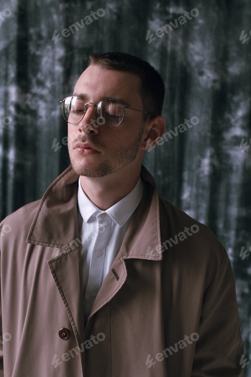 Preview: A Lonely Handsome Guy In A Raincoat And Glasses With Different Moods