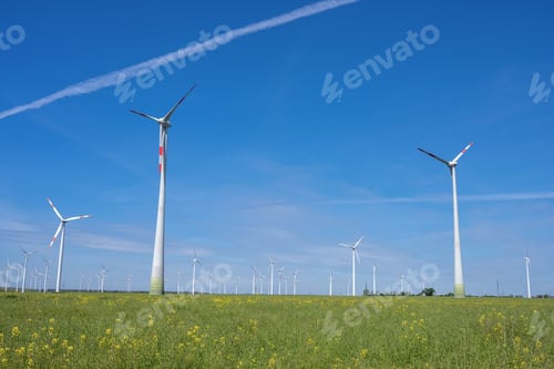 Preview: Modern wind wheels with a clear blue sky