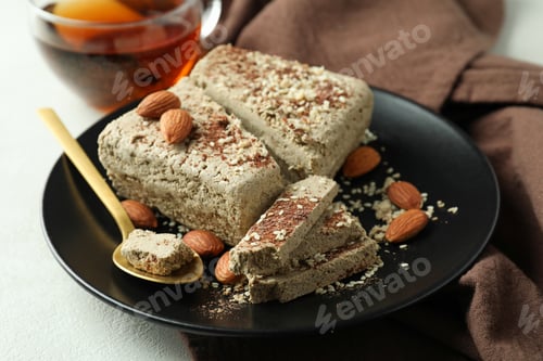 Preview: Concept of tasty food with halva on white textured background