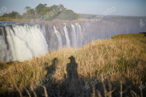Preview: Shadow of tourists on grass, Victoria Falls, Zimbabwe