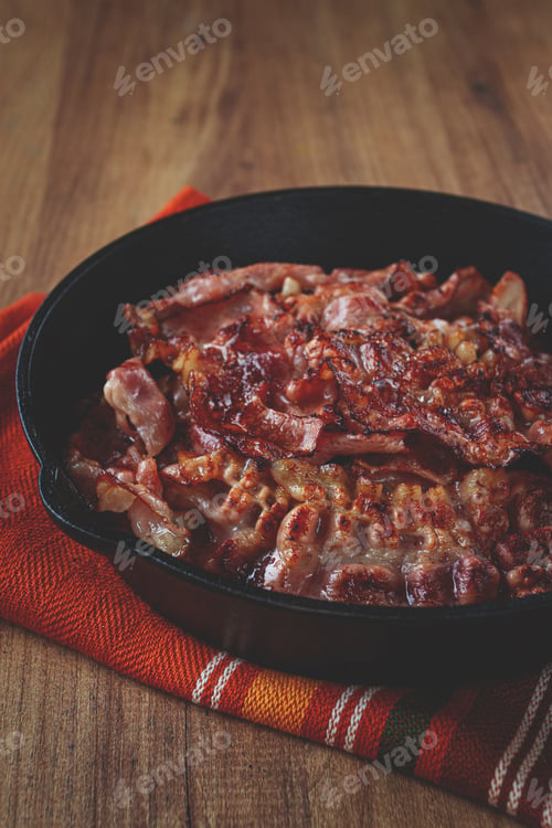 Preview: Crispy bacon, on a cast-iron skillet, on a wooden table, rustic style, no people