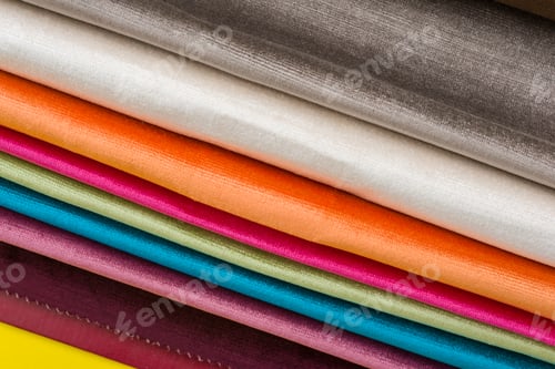 Preview: Colorful Fabrics Stacked with Varying Hues and Textures