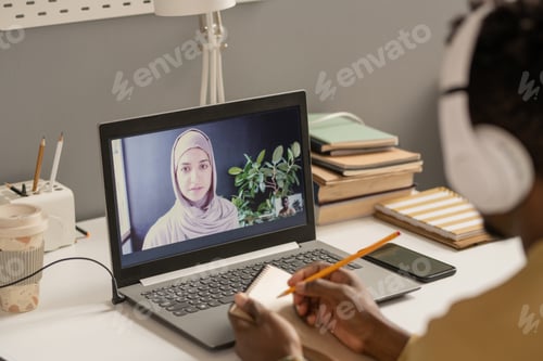 Preview: Student Learning Online with Woman Instructor on Laptop