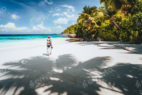 Preview: Female tourist enjoy empty tropical beach on vacation. White sand beach, palm trees and blue ocean