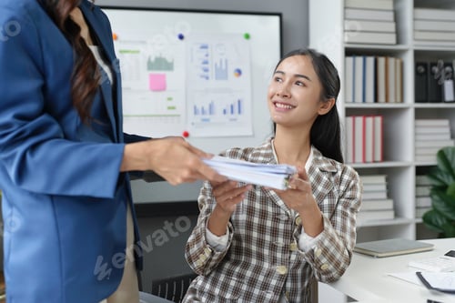 Preview: Businesswoman Receiving Documents in Modern Office
