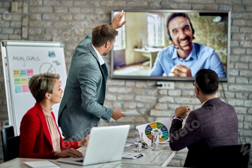 Preview: Business team having video conference meeting in the office.