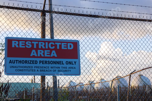 Preview: a red and white sign with writing on it, that reads restricted area