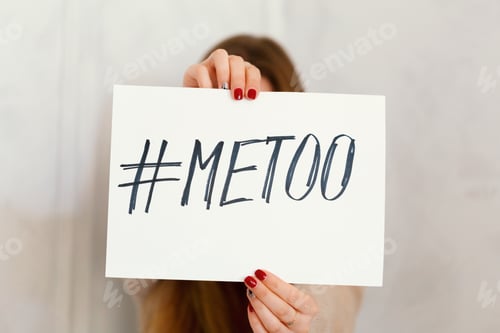 Preview: woman showing a note with the text me too