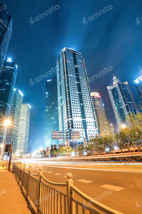 Preview: the light trails on the modern building background