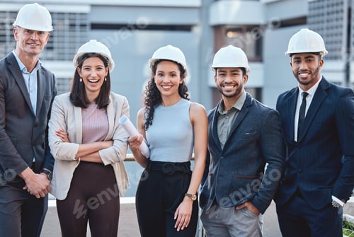 Preview: Shot of a group of businesspeople wearing hardhats while standing outside