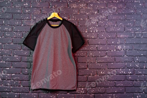 Preview: Black plain t-shirt hanging on a hanger