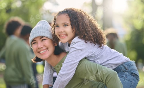 Preview: Mother smile, piggy back hug and interracial family with girl and mom together in nature. Park, hap