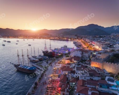 Preview: Aerial view of boats and yahts and beautiful architecture at sunset