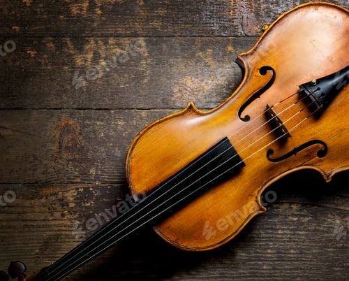 Preview: Violin on rustic wooden background from above.