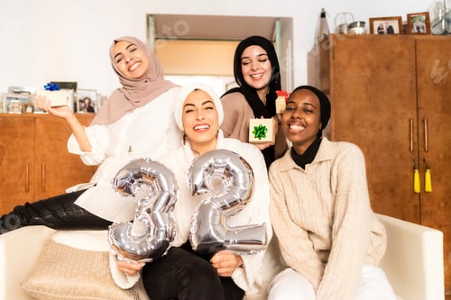 Preview: Friends Celebrating Together Indoors with Balloons