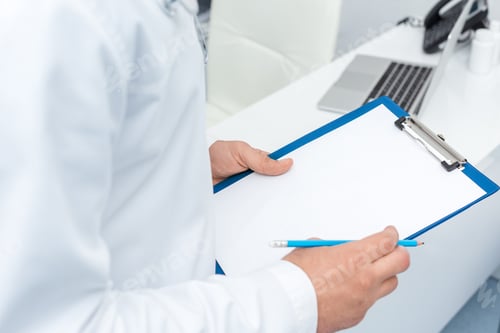 Preview: cropped shot of doctor holding clipboard with blank paper