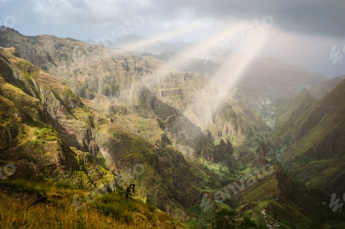 Preview: Sun rays coming through the clouds in rocky mountain landscape of in Xo-xo valley in Santo Antao
