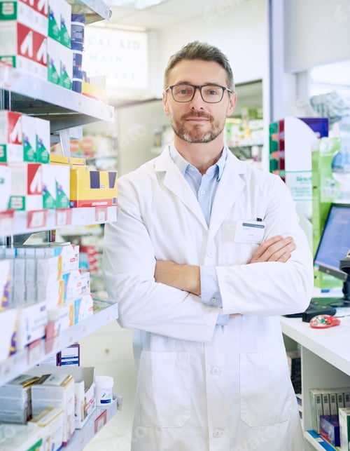 Preview: Portrait of a confident mature pharmacist working in a pharmacy