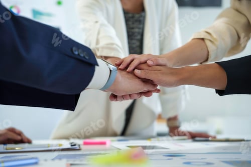 Preview: Diverse Team Collaborating with Hands Joined in Unity
