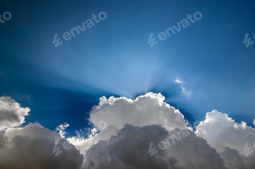 Preview: Blue sky with puffy white clouds in bright clear sunny day