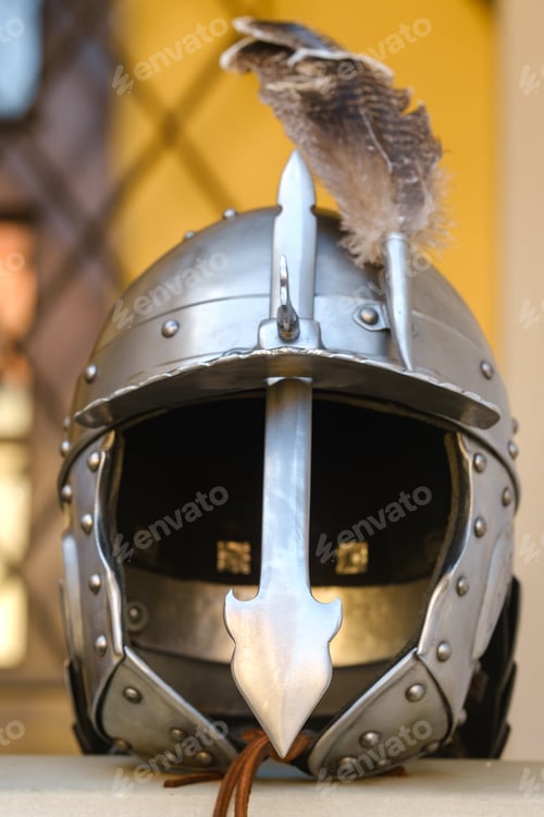 Preview: An ancient knight's helmet with a feather .Medieval concept