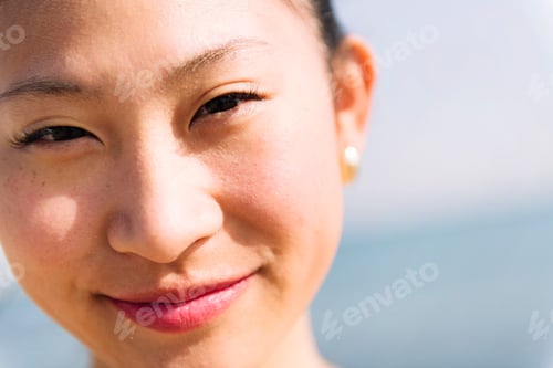 Preview: cute asian woman smiling happy looking at camera