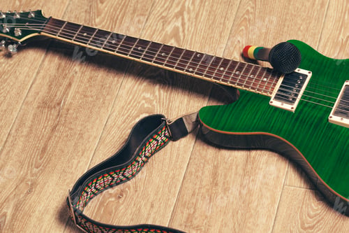 Preview: Electric guitar body and neck detail on wooden background