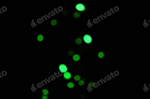 Preview: Green light, bokeh and dots on dark background on a mockup space. Blur, black backdrop and defocuse