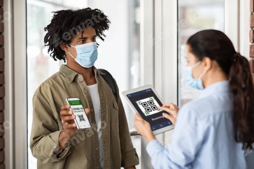 Preview: Young African American Man Showing Vaccination Certificate On Smartphone At Cafe Entrance