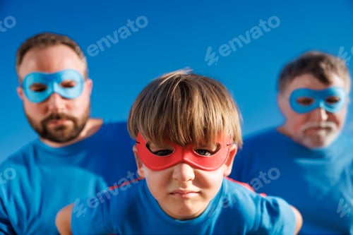 Preview: Grandfather, father and son having fun outdoor. Fathers day