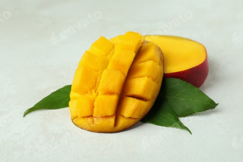 Preview: Tasty ripe mango fruit on white textured background