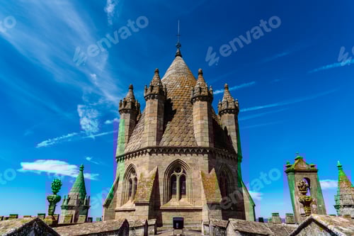 Preview: Lantern tower of the Cathedral of Evora. Low angle view against blue sky