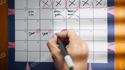 Preview: hand marking date on the calendar