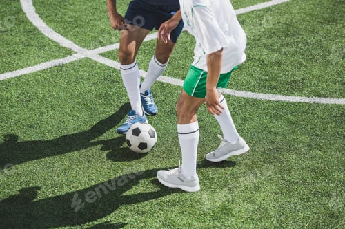 Preview: partial view of athletic soccer players playing soccer on pitch