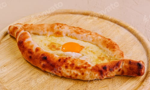 Preview: Ajarian Khachapuri, filled with cheese and topped with egg yolk