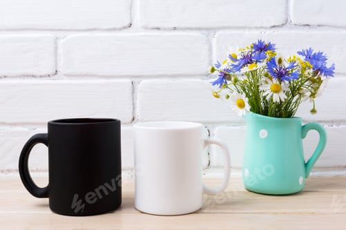 Preview: White and black mug mockup with cornflower and daisy