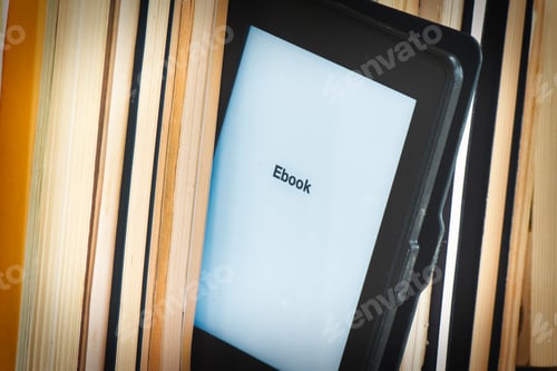 Preview: Detail of an e-book reader among classic books