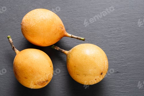 Preview: Three Ripe Passion Fruits On Slate Background
