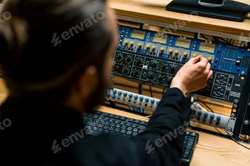 Preview: Sound engineer used digital audio mixer Sliders Engineer presses key Control panel Recording studio