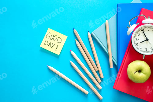 Preview: Flat lay composition with colorful educational supplies on blue background.
