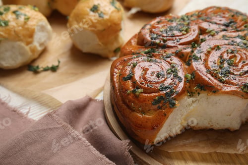 Preview: Traditional Ukrainian bread (Pampushky) with garlic on white wooden table, space for text