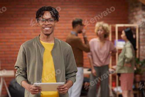 Preview: African businessman standing at office