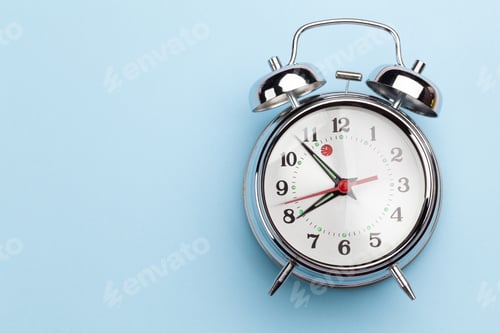 Preview: Blue workplace with alarm clock